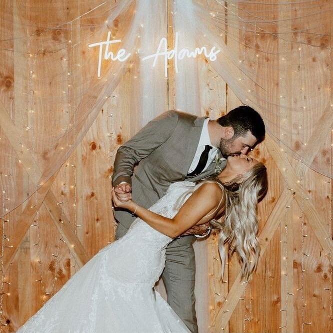 Groom dipping bride.