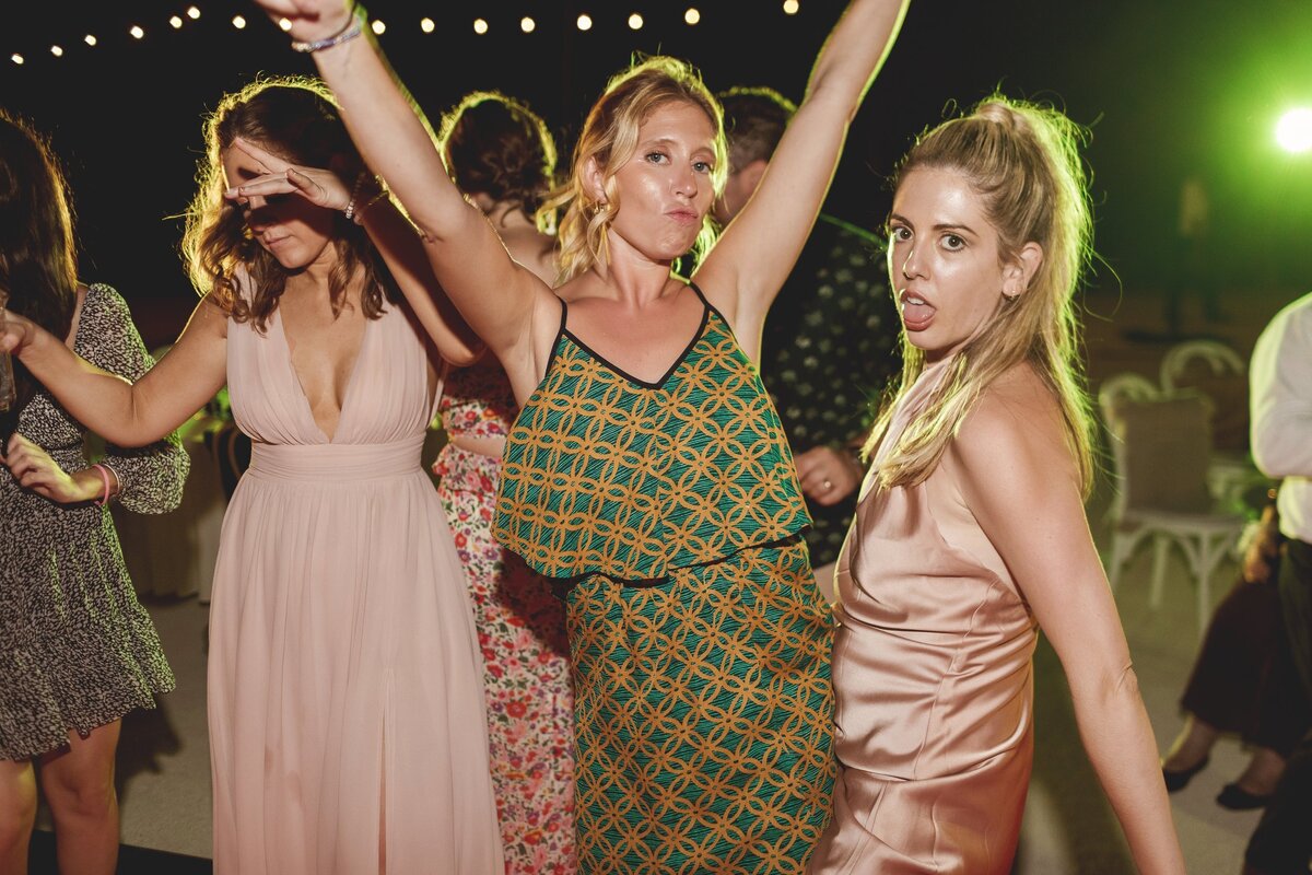 Drunk guests dancing at wedding reception