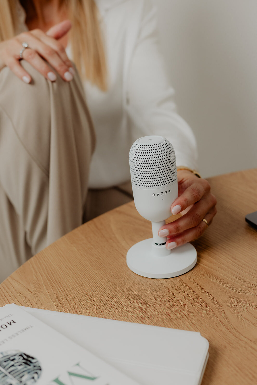 hand with a podcast mic