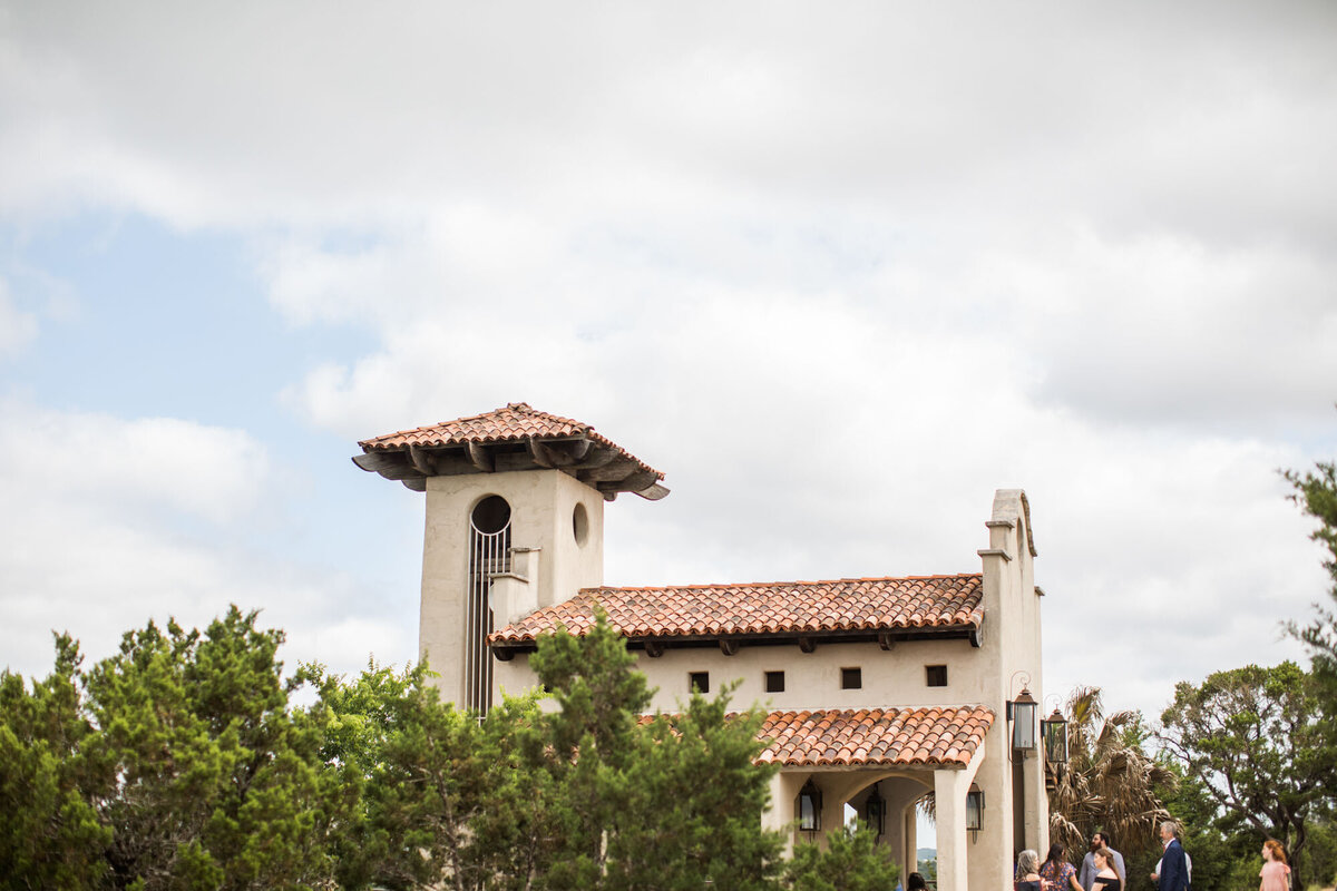 Spanish-style chapel surrounded by greenery