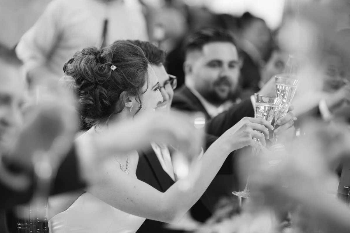 Black and white photo of couple toasting