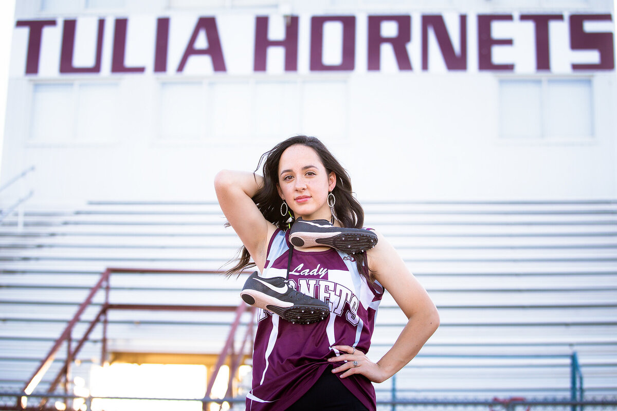 Senior girl track player with track shoes