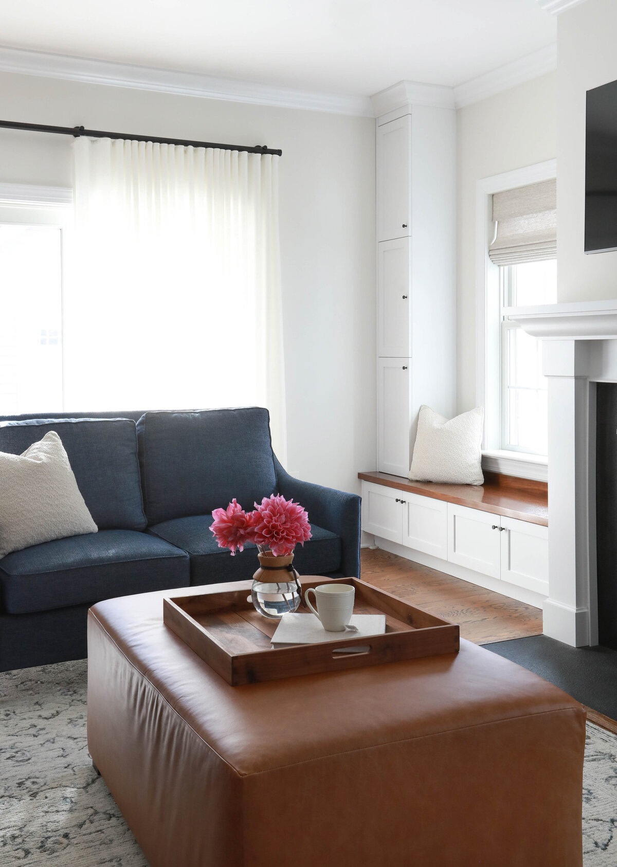 NAVY-SOFA-WITH-LEATHER-OTTOMAN-WINDOW-SEAT-DRAPERY-FAIR-HAVEN-NJ