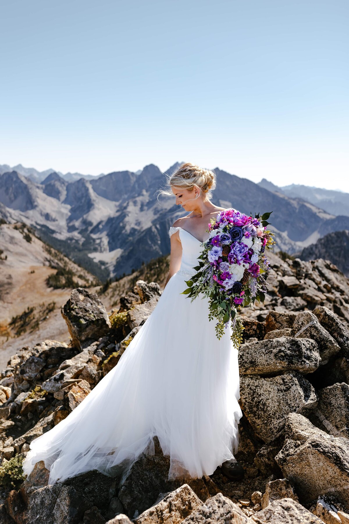 Bridal photo of a bride on a mountain peak in the Sawtooth range near Stanley, Idaho