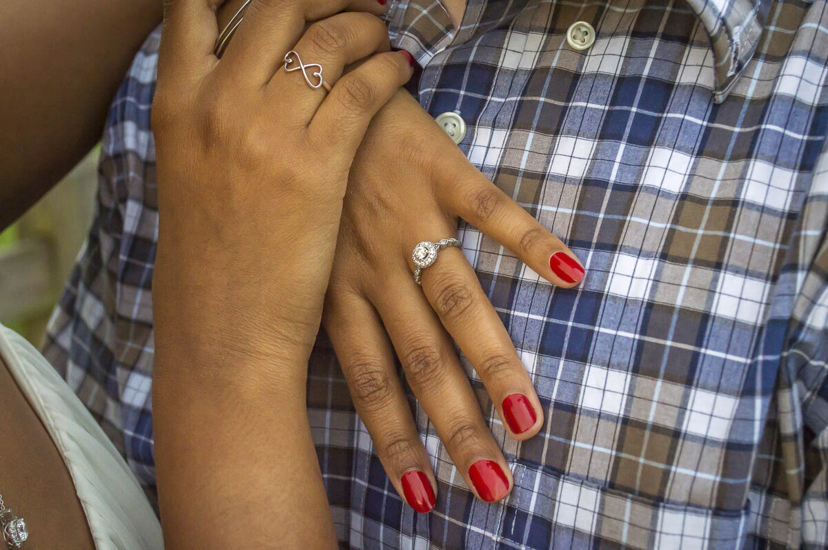 Couple shows off her engagement ring.