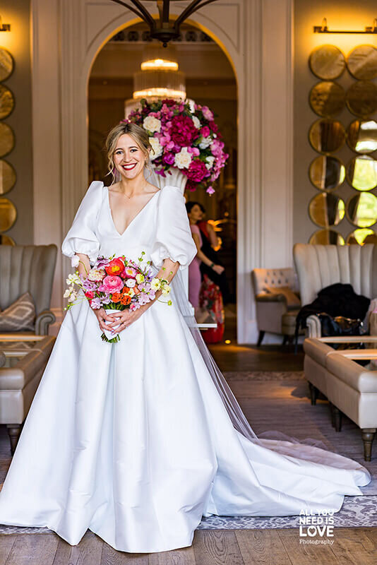 Bride holding bright bouquet 174