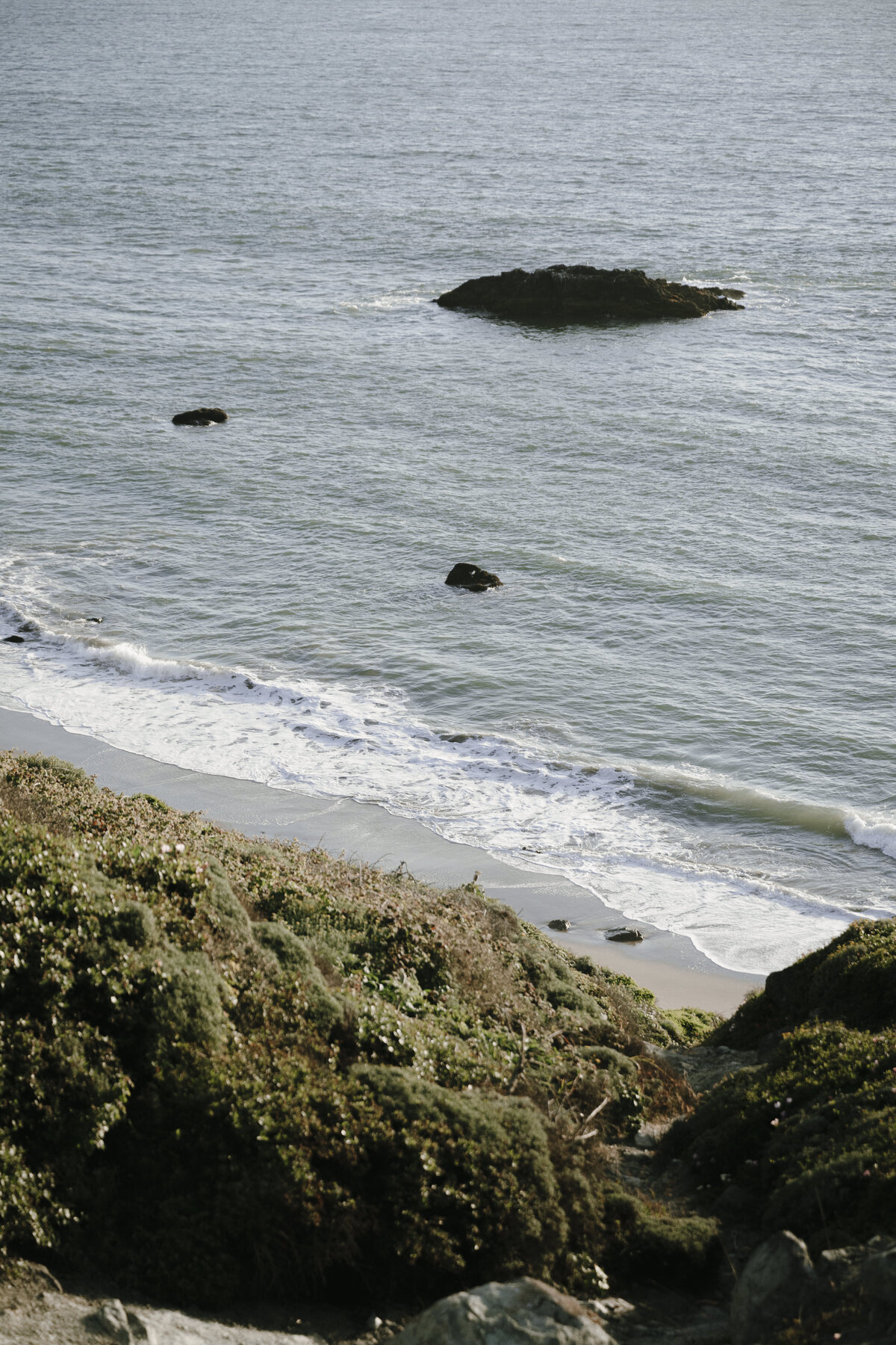 Bride and Groom at Marshall's Beach in San Francisco, California at sunset