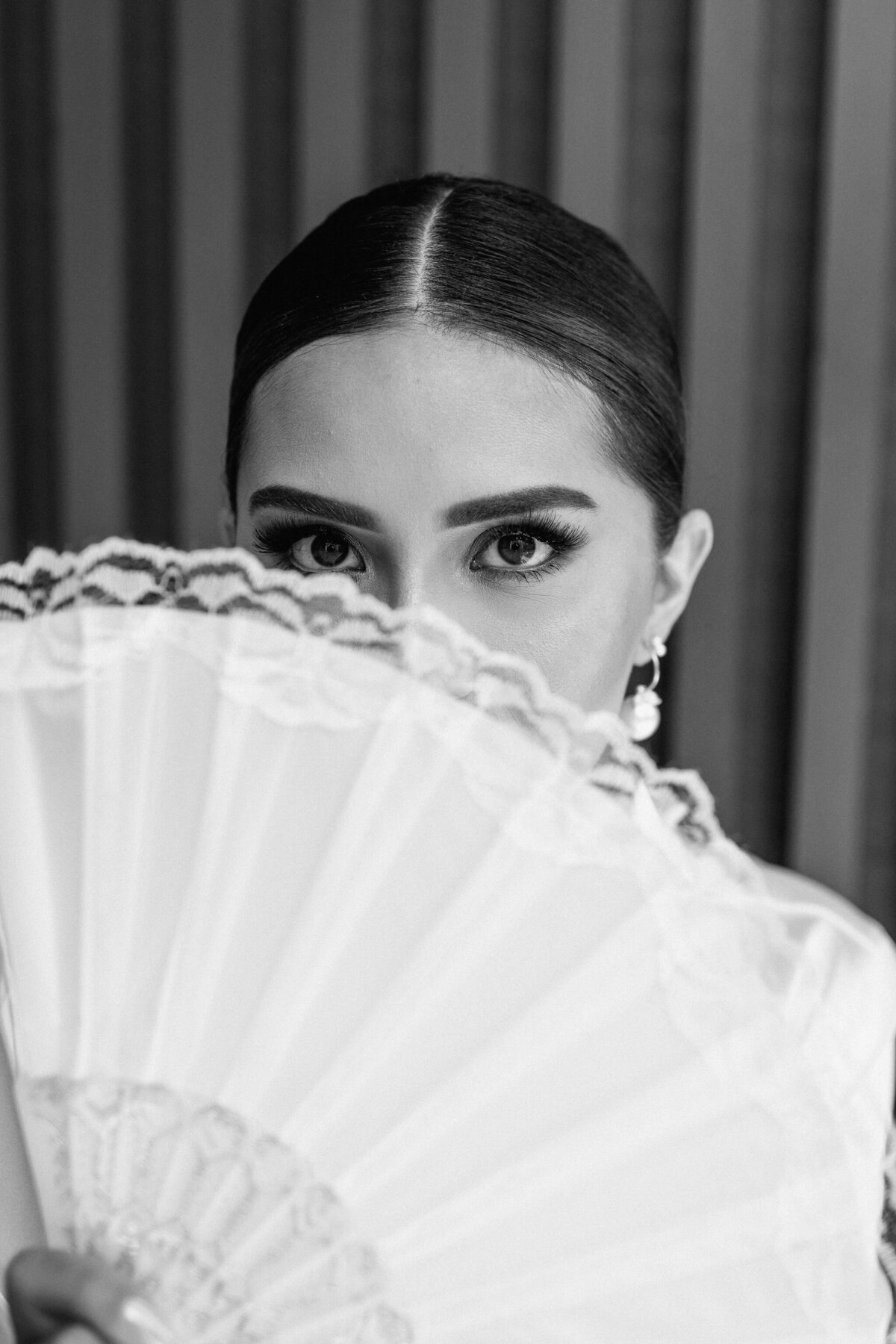 Stunning Bride poses in front of Hart and Main. Her Eyes exude beauty and class 