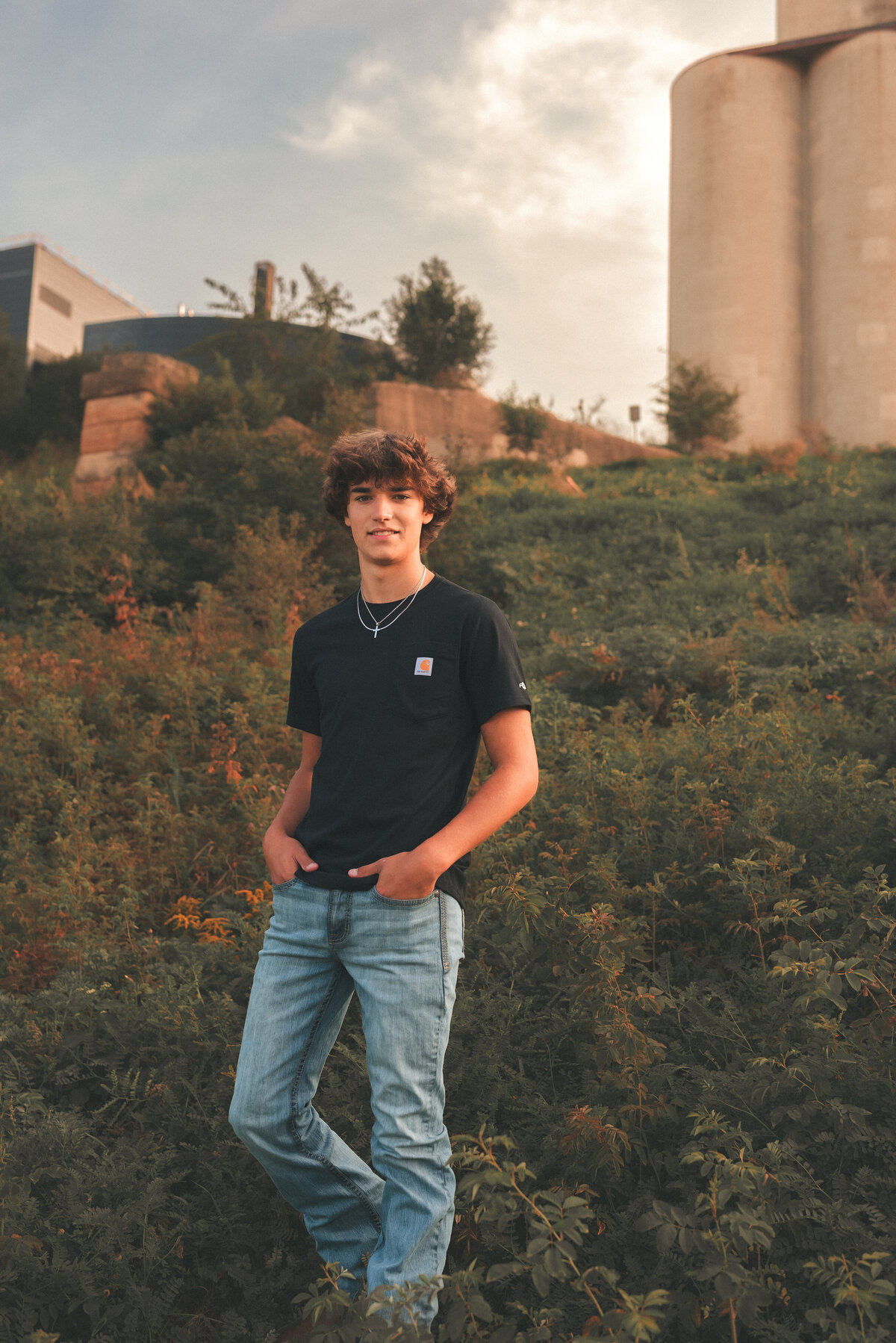 Photographer Shannon O’Malley laughing and posing confidently, Minneapolis-St. Paul senior portrait specialist offering authentic, natural-light sessions.