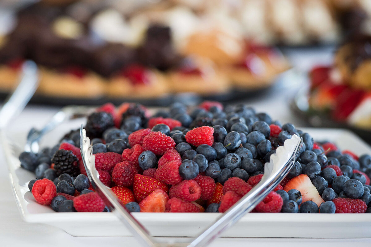 Ottawa event photography showing a tray of berries as part of the snacks being served for a corporate anniversary celebration.  Captured by JEMMAN Photography COMMERCIAL