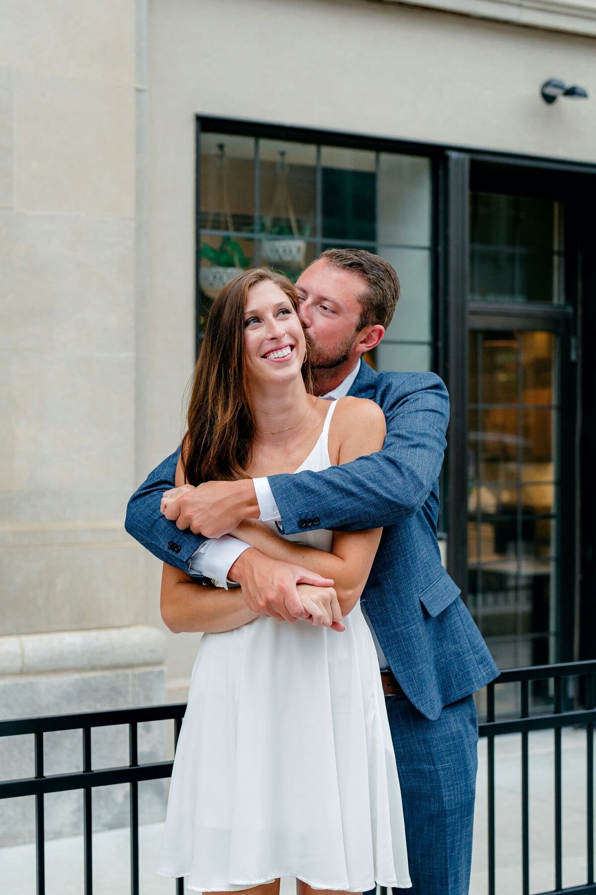 man-hugging-woman-laughing-urban-engagement