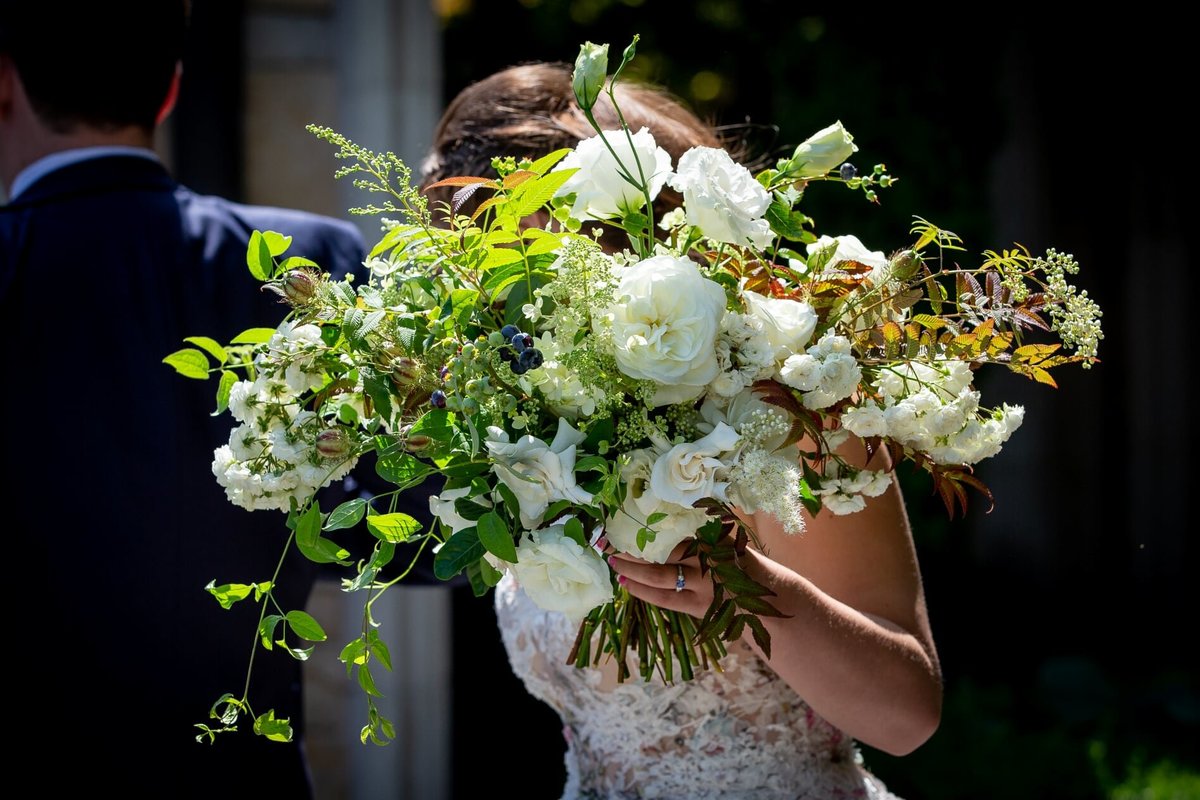 Garden style bridal bouquet with garden roses, fairy roses, trailing greenery