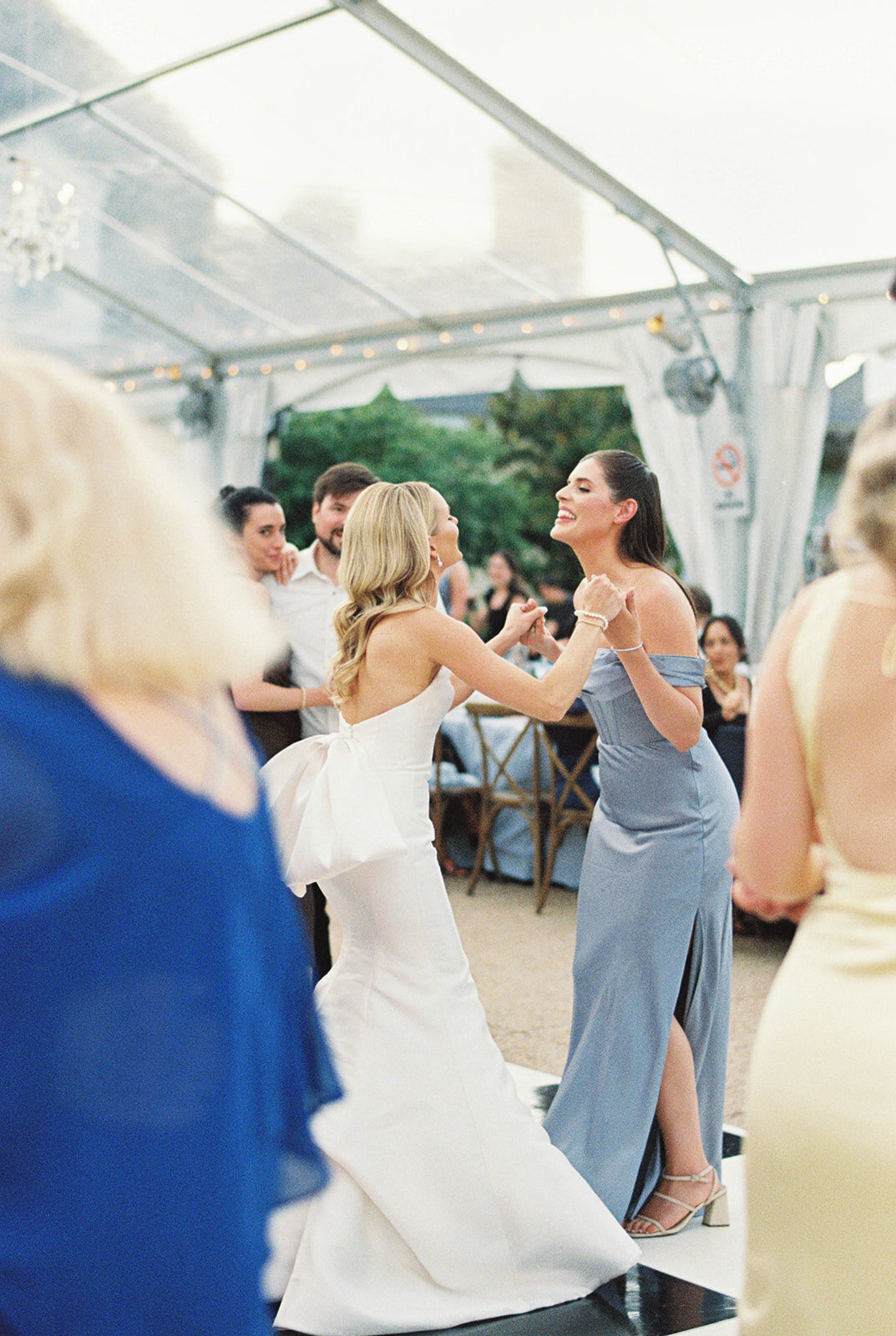 Bride and her best friend dancing on the dance floor.