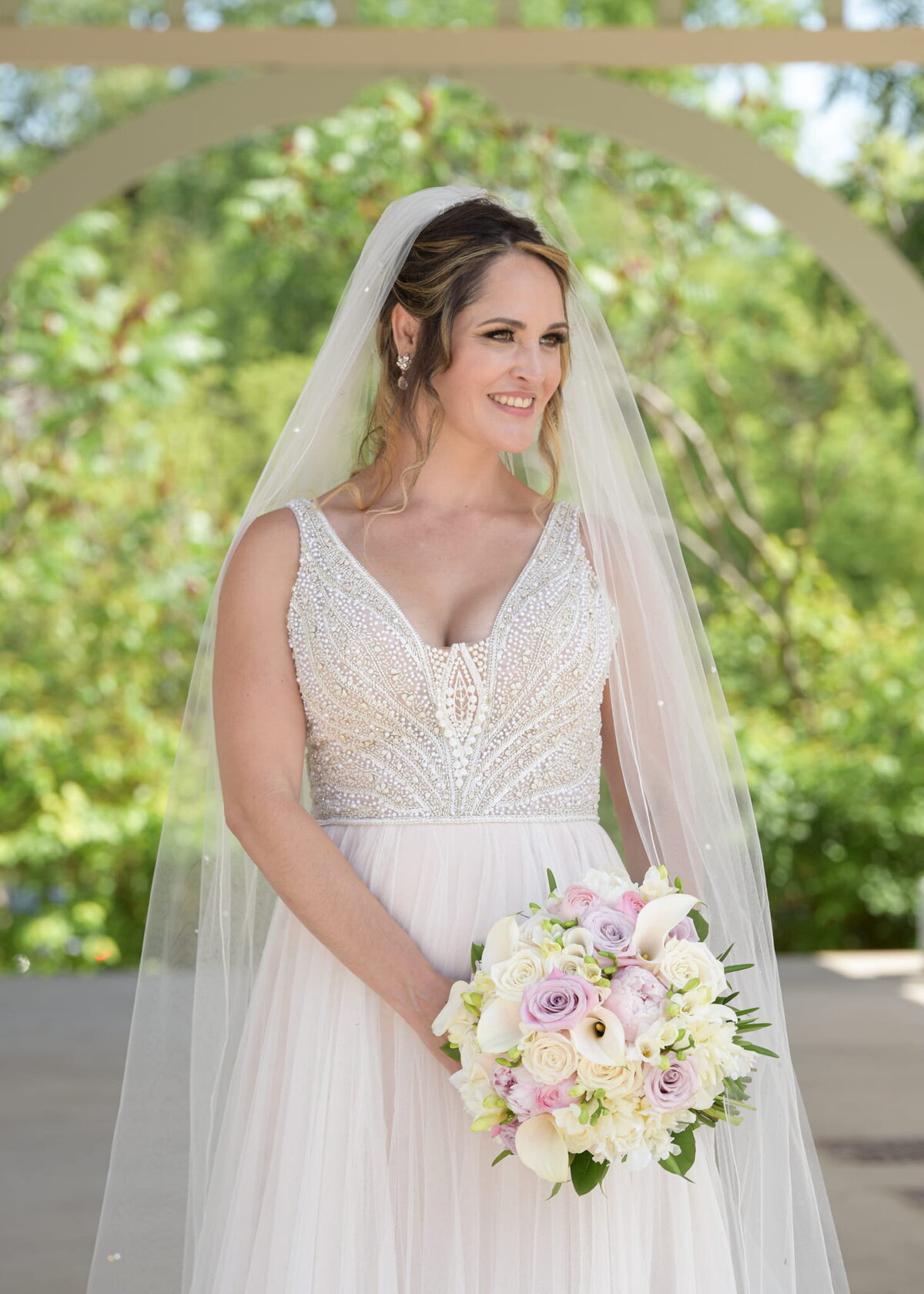 Bride with veil in a serene setting
