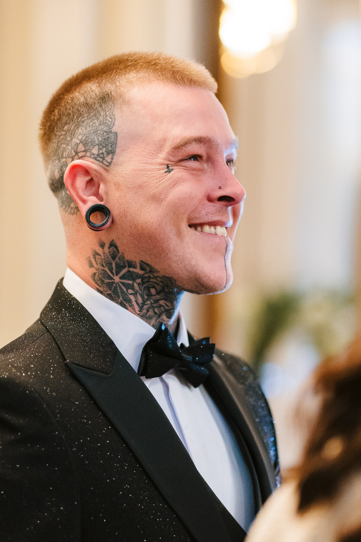Groom looking at bridesmaids walking down stairs takne at Ashfield house by Anthony Horseman Photography and Film