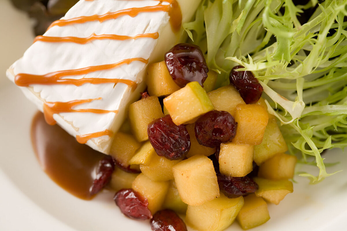 Brie cheese with apple and cranberry salad