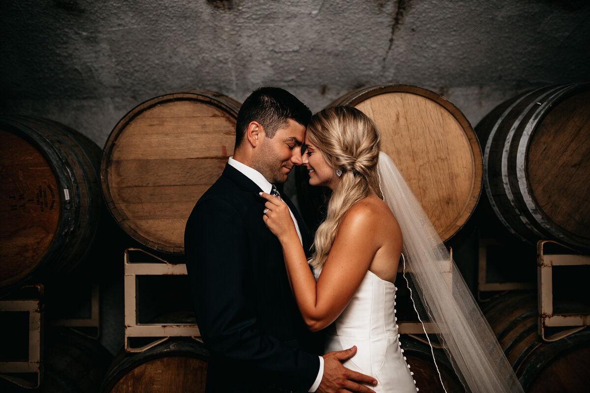 bride and groom in wine cellar