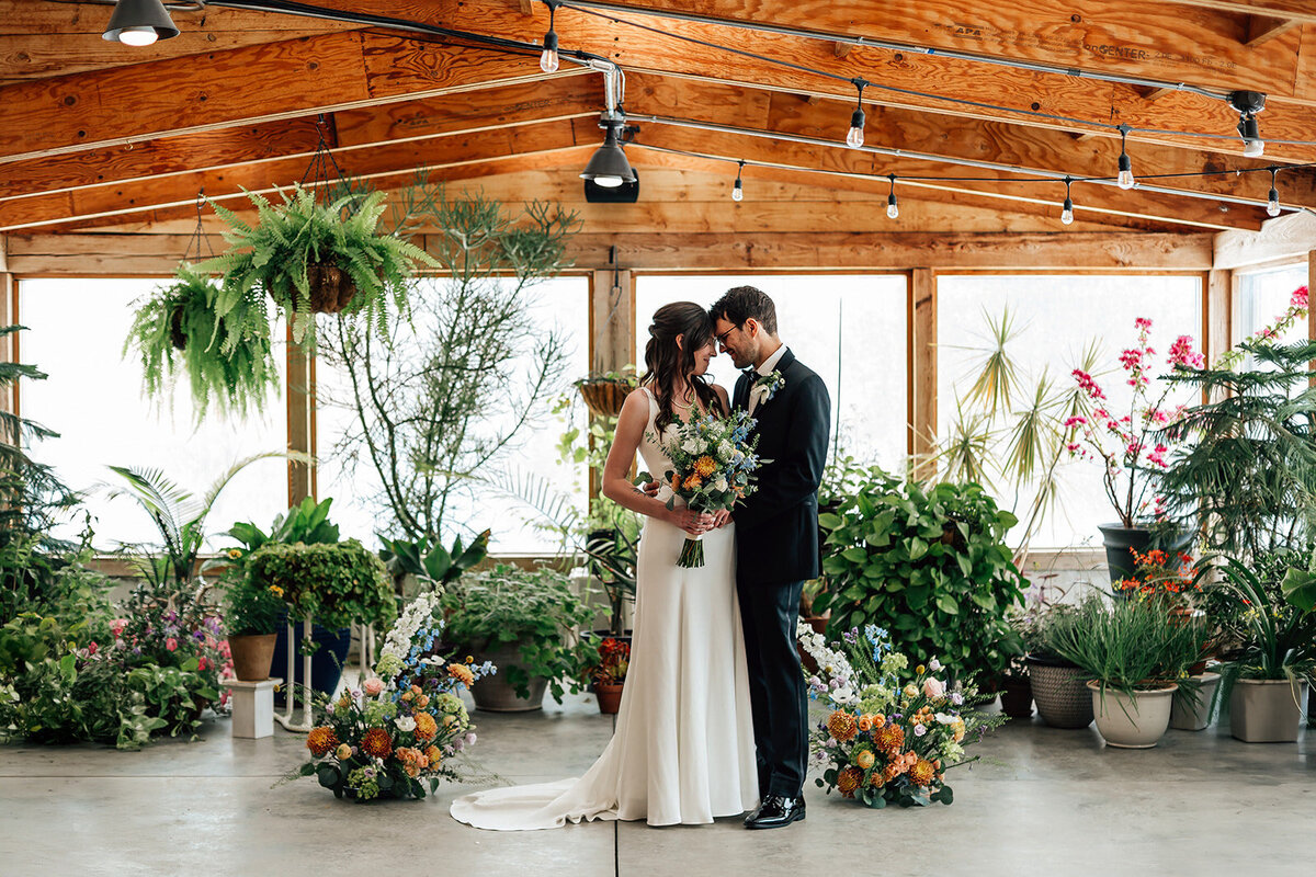 Couple kissing at the arnold house at a wedding planned by kr occasions 