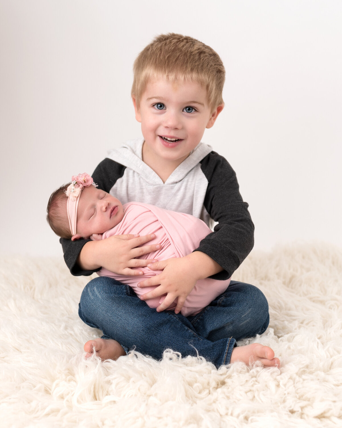 Sibling and Newborn Photoshoot in Furry background