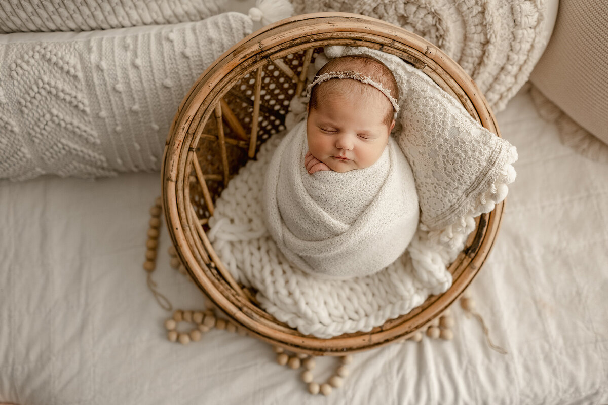 baby girls posed in an all cream boho lifestyle area in our loveland photography studio