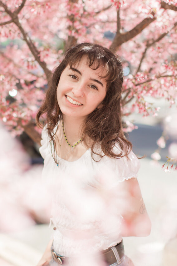 teen girl by pink tree