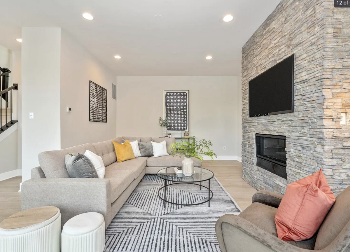 Living room with fireplace and striped rug
