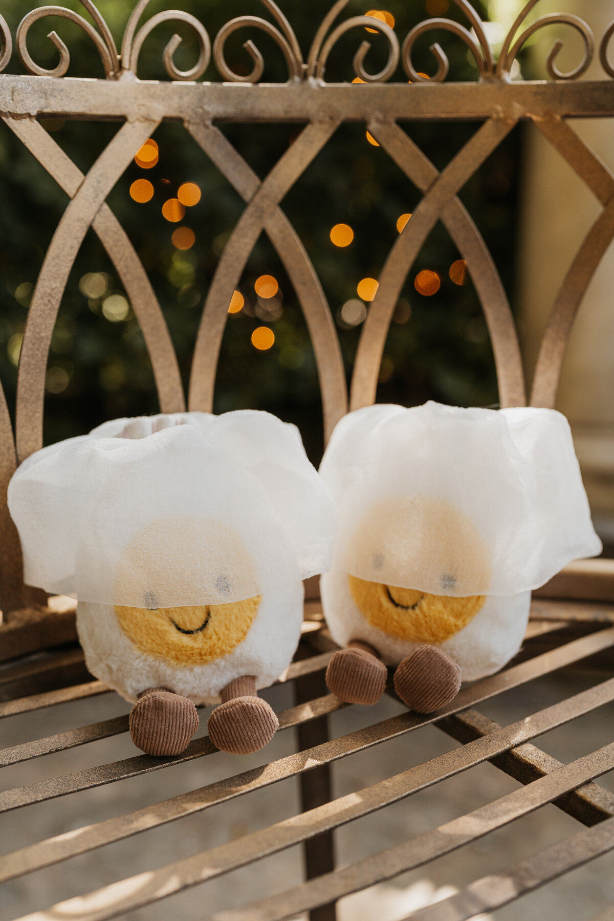Two small plush tows with veils on top 