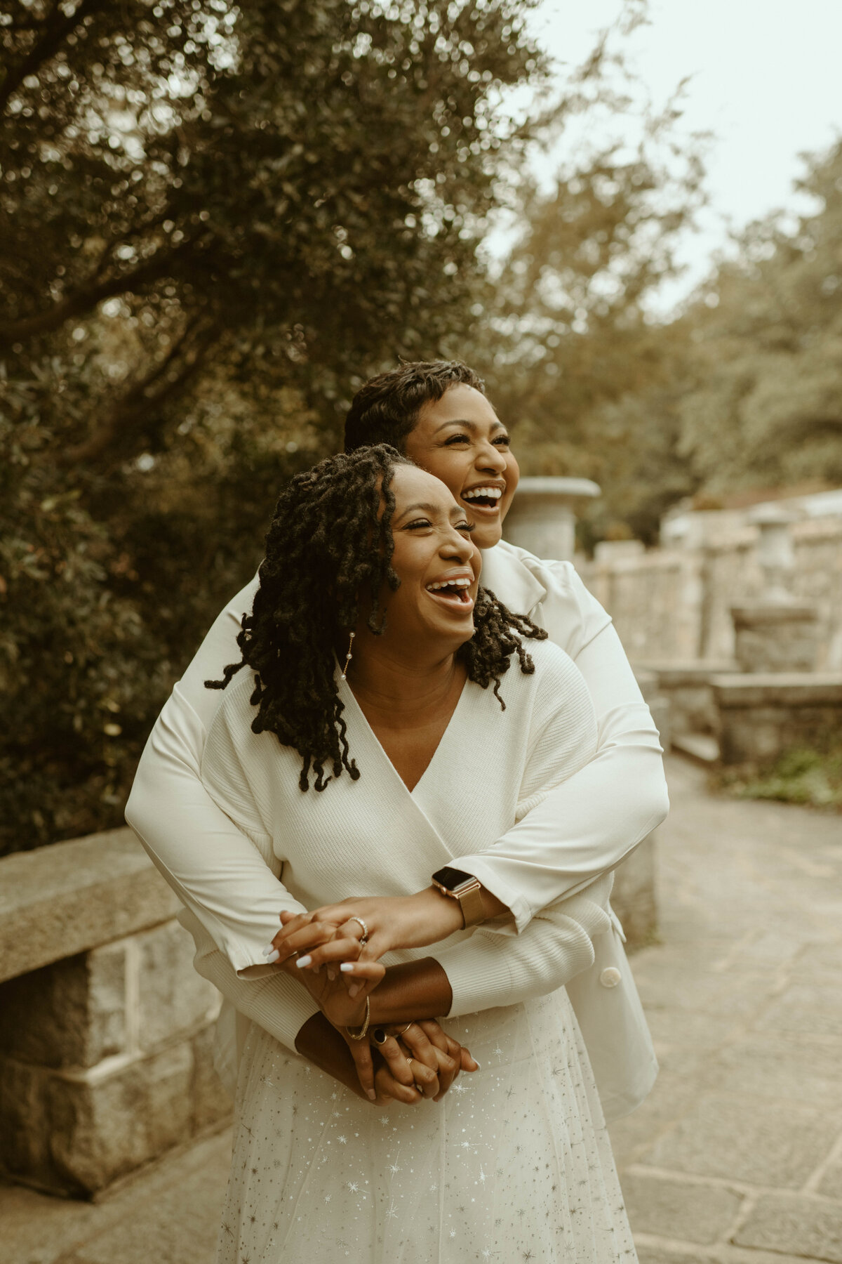 lgbtq+ couple  dancing at maymont park during their engagement session in richmond, va