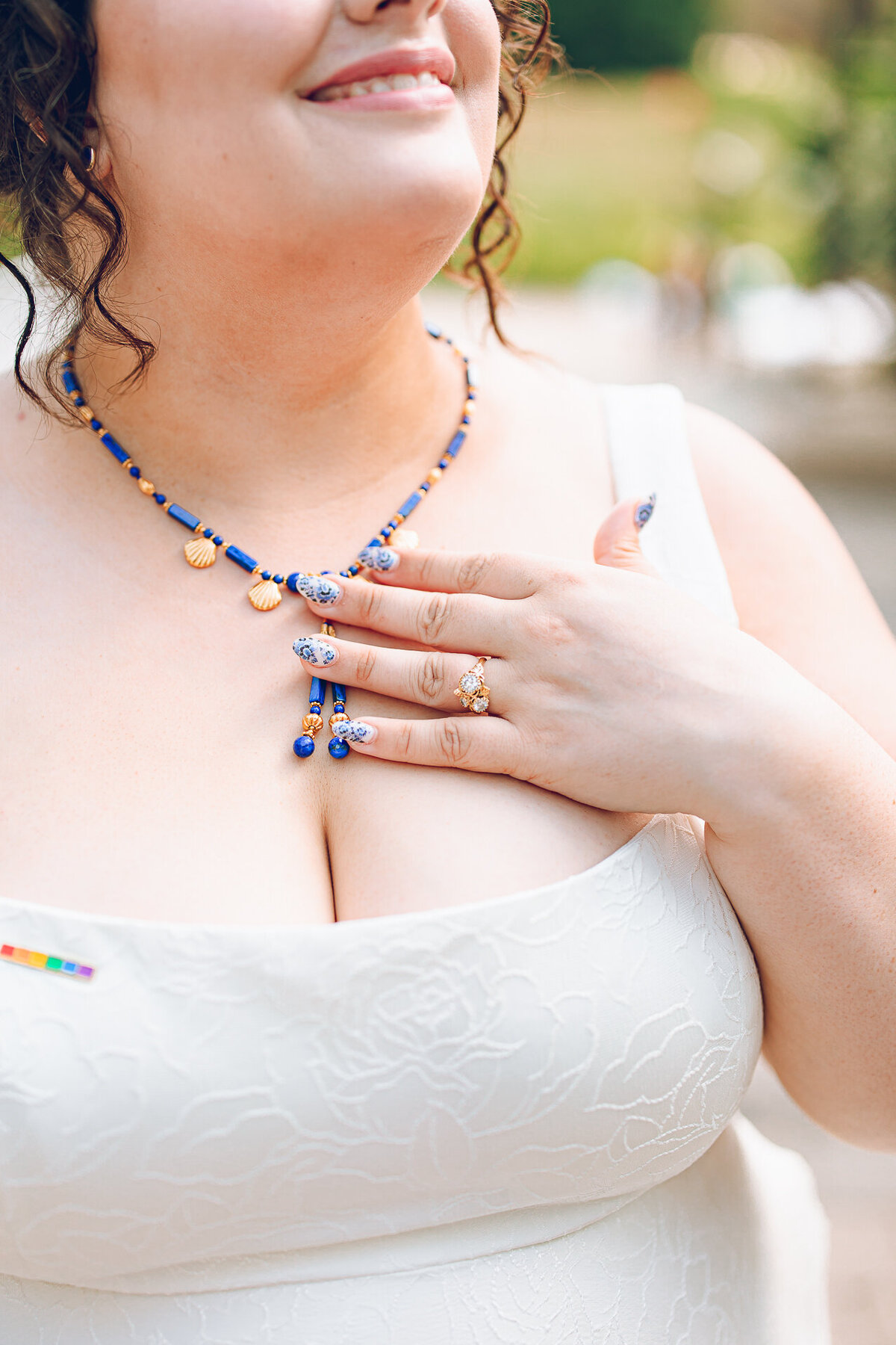 A queer couple poses for their wedding at the Cancer Survivors Garden at Maggie Daley Park