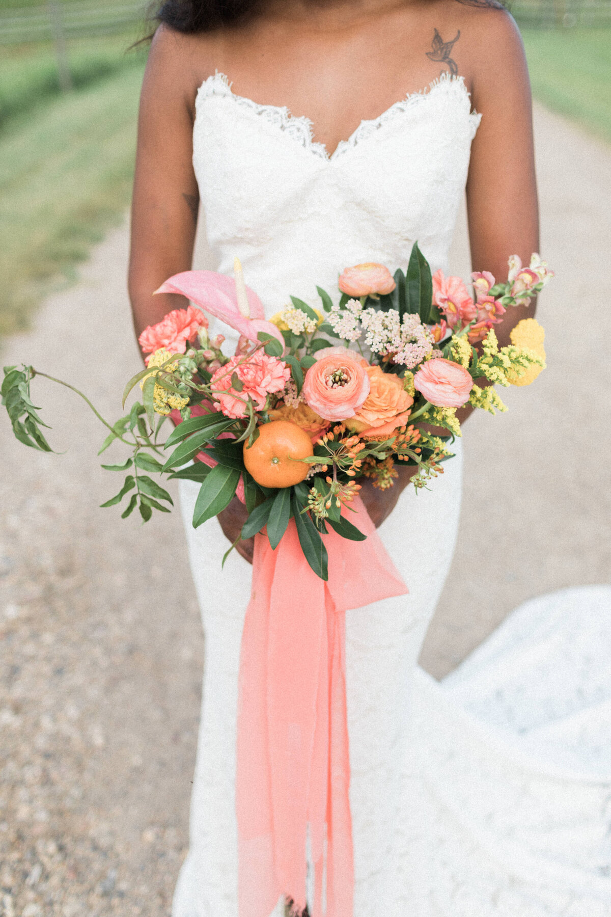 Bright and colourful bouquet with pink, yellow and tangerine by Meadow & Vine Floral, romantic Alberta wedding florist, featured on the Brontë Bride Vendor Guide.