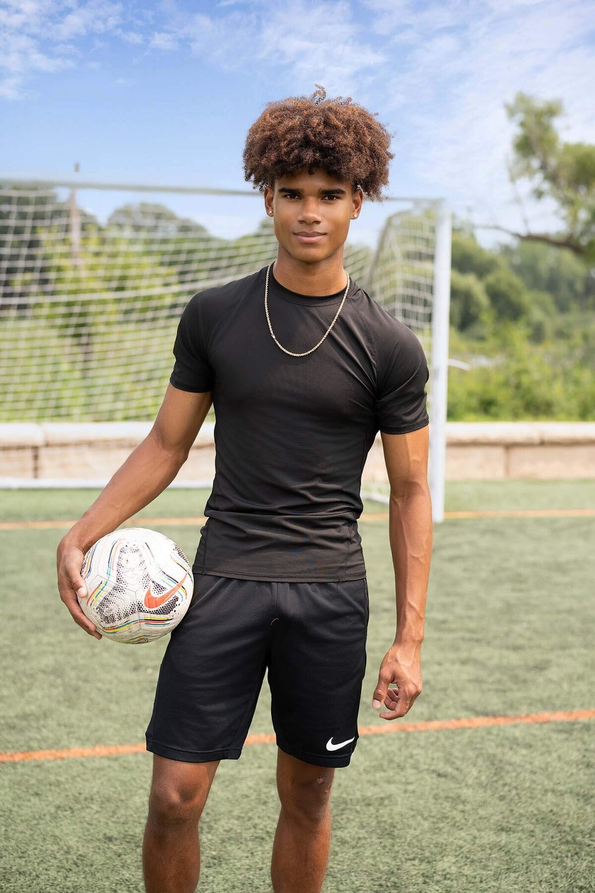 senior-guy-holding-soccer-ball
