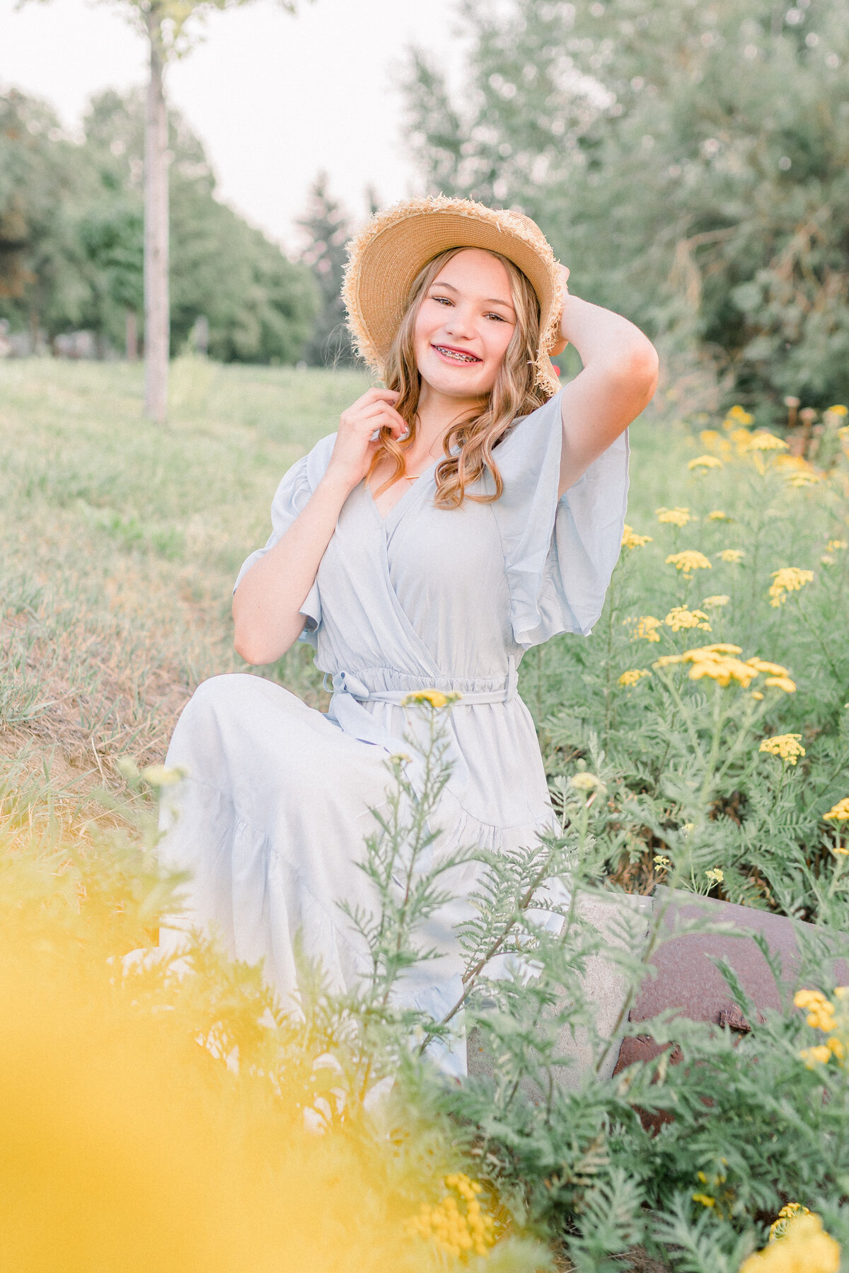 Austin Texas High school girl with casual outfit in the wildflowers for senior photos.