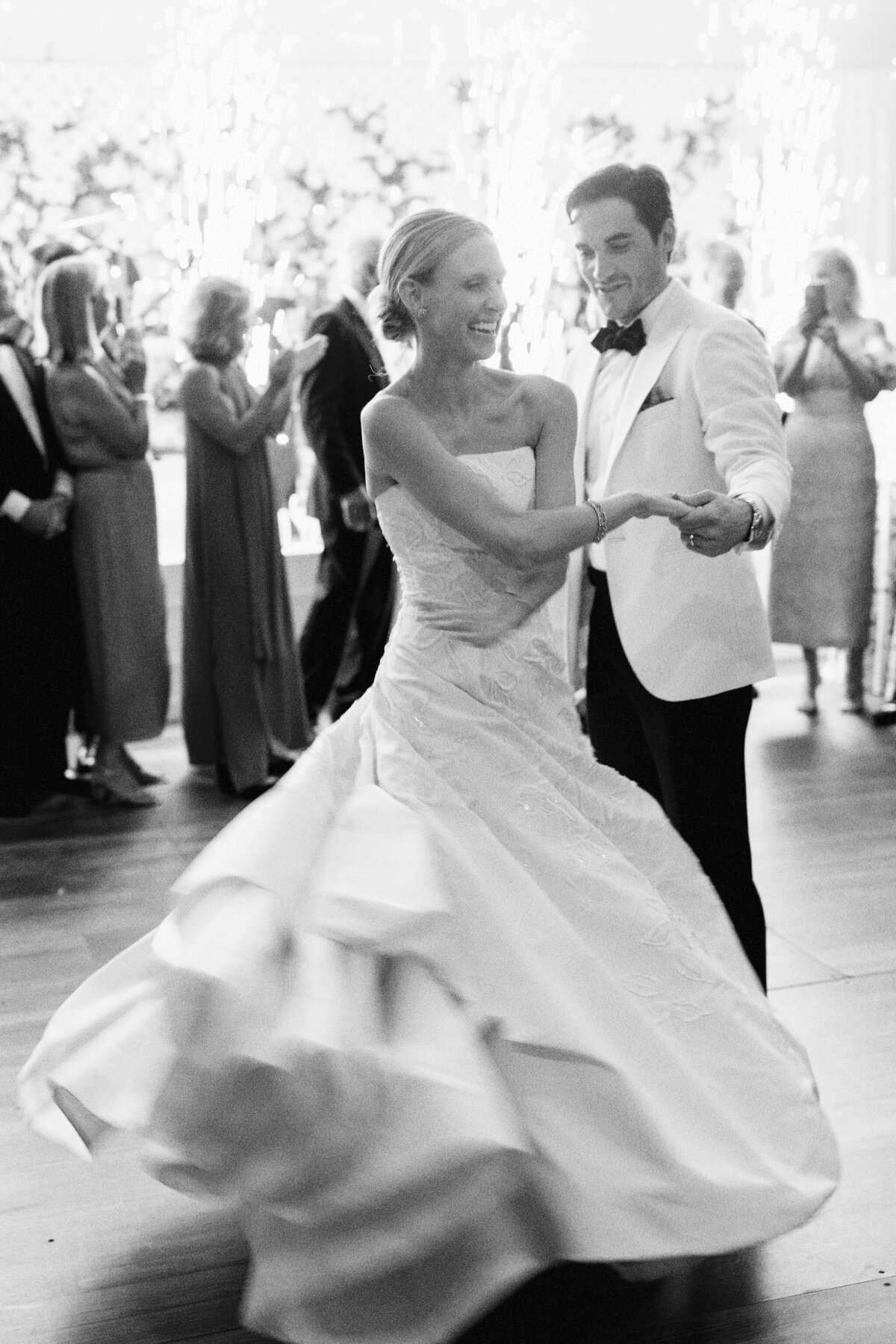 Close up of the bride holding the grooms hand while on the dance floor. 