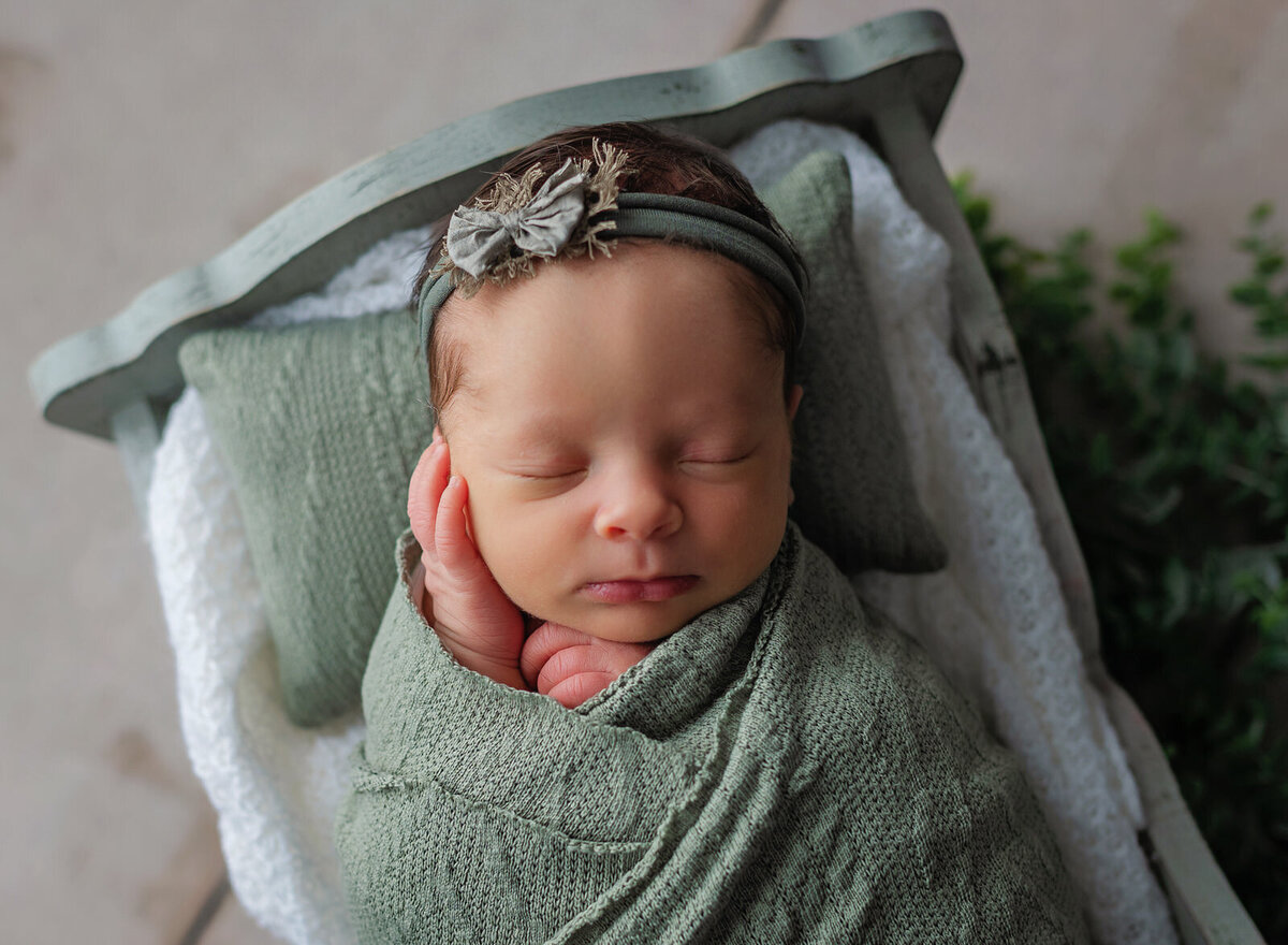 pensacola-newborn-photography-baby-girl-swaddled-in-green