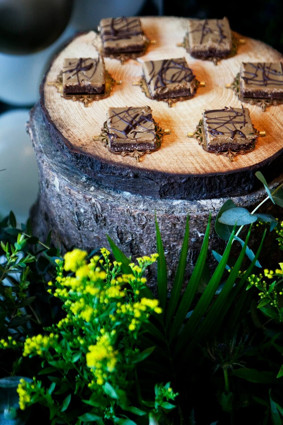 Mini brownie bites on a wooden log plate