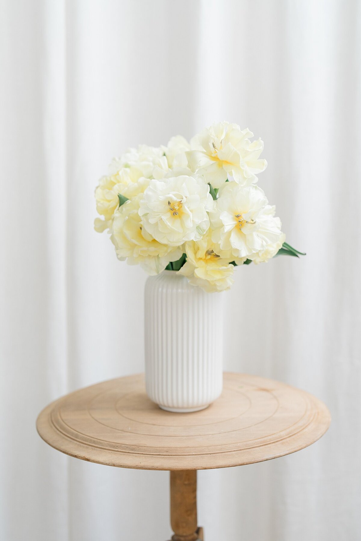 white fluffy flowers in a vase for a florist brand photos captured by branding photographers Columbus