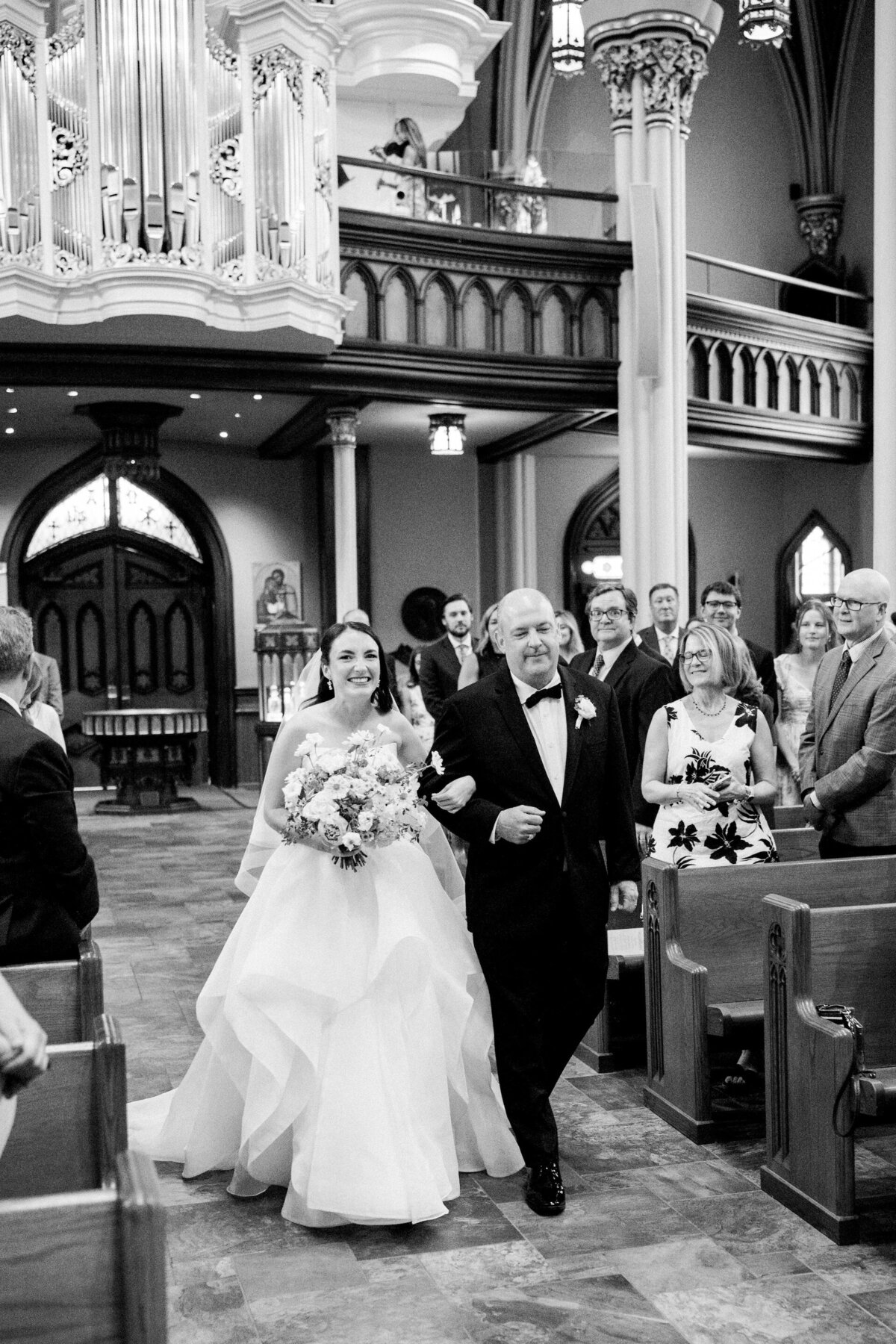 father walking daughter down the aisle for her wedding