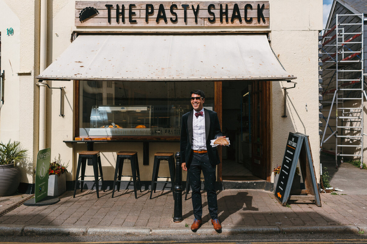 Wedding guest picks up a Pasty en route to reception in Salcombe