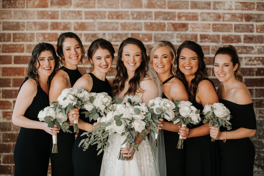 Elegant black tie wedding with the perfect black bridesmaids gowns