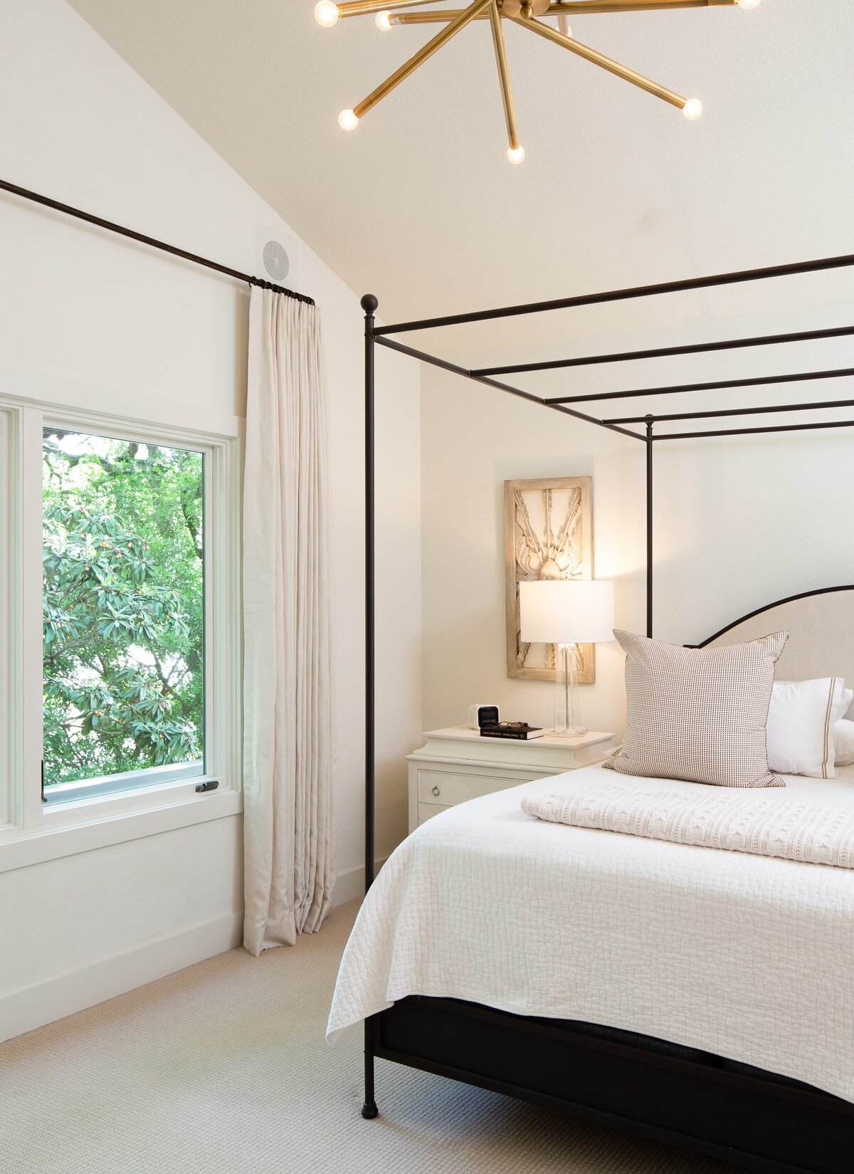 the keeping room interiors grant bedroom with white curtains and white bedside table