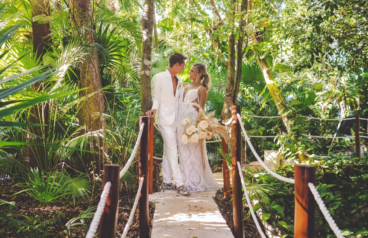 Bride and grom hanging out on paths at viceroy riviera maya wedding
