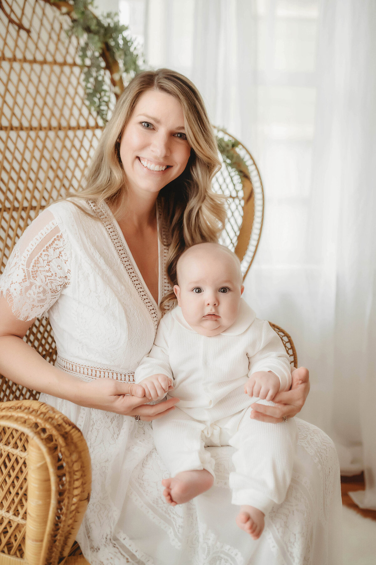 Mother embraces her baby during baby photoshoot in Charleston, SC.
