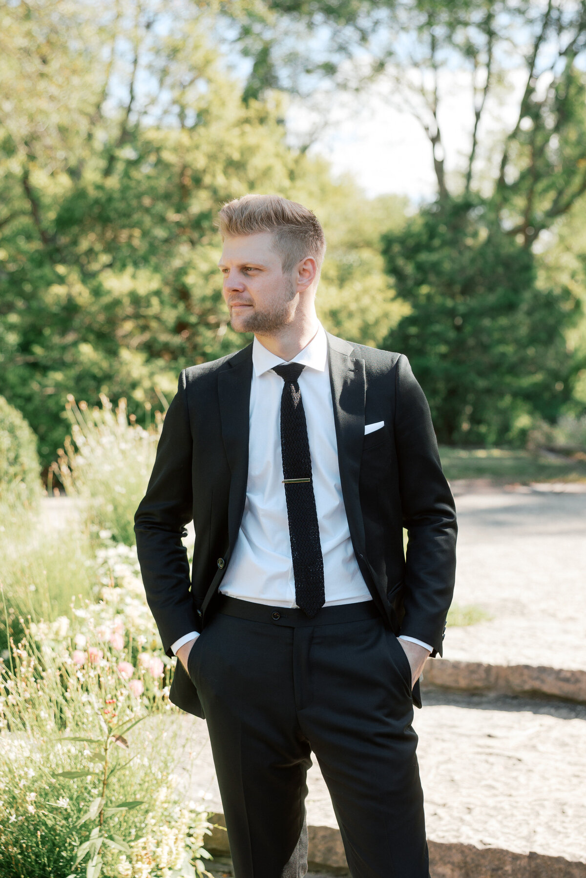 Groom gazes off-camera during Dayton garden wedding, Philadelphia wedding photographer snapshot.