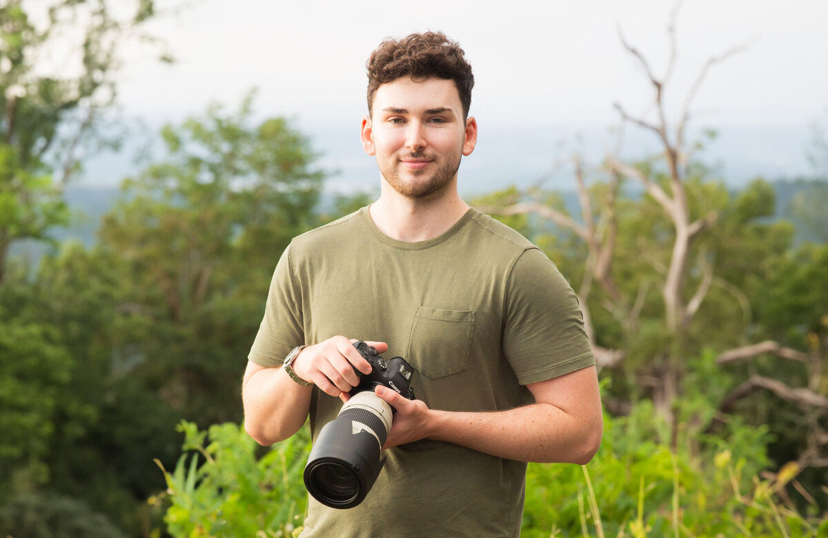 Kyle Cusack Photography about image holding a camera