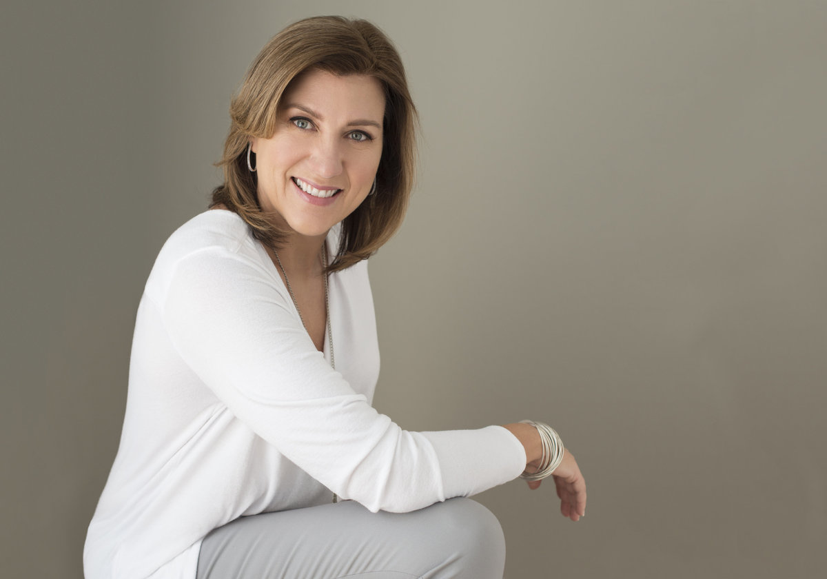 powerful  confident headshot of consultant with  short blondhair wearing white  shirt  dor  corporate brouchure and marketing material ontario , mississauga , canada