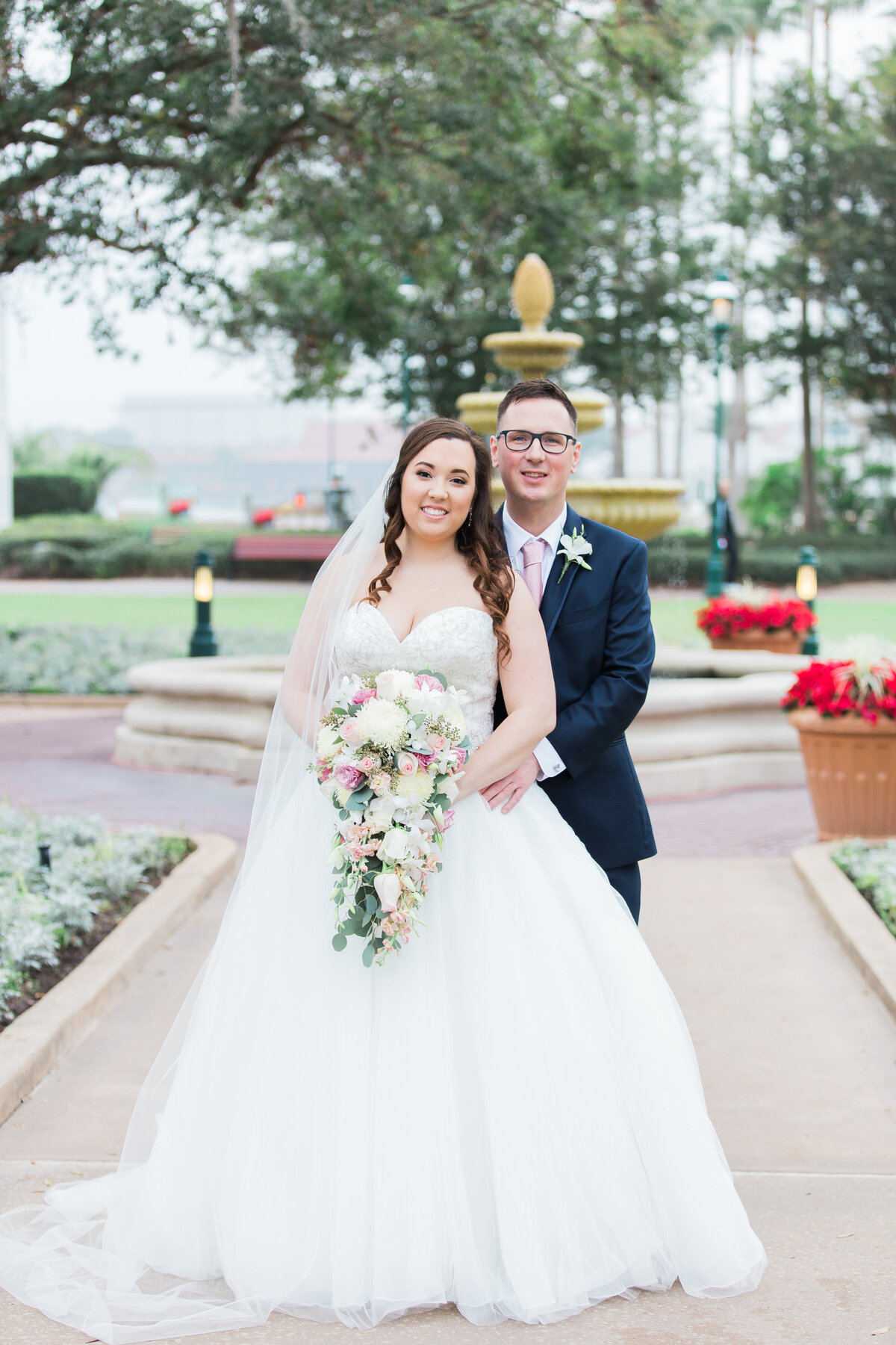 Couple smiling for wedding photo in Disney