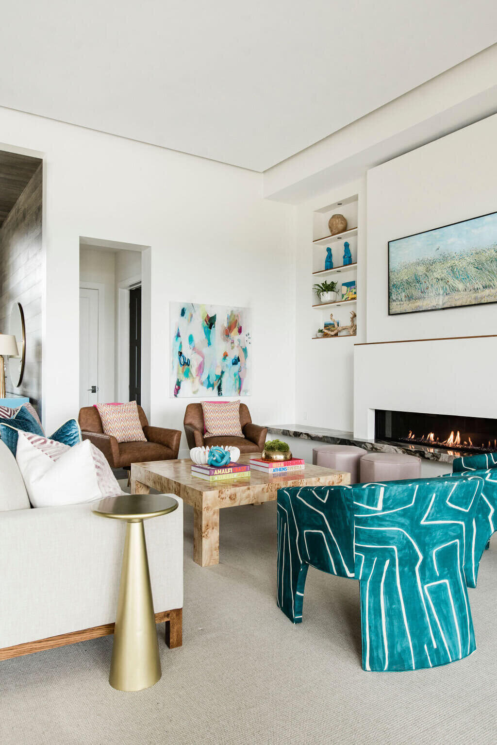 oyster creek studios austin barton creek gold side table with white sofa brown and turquoise seating in living room