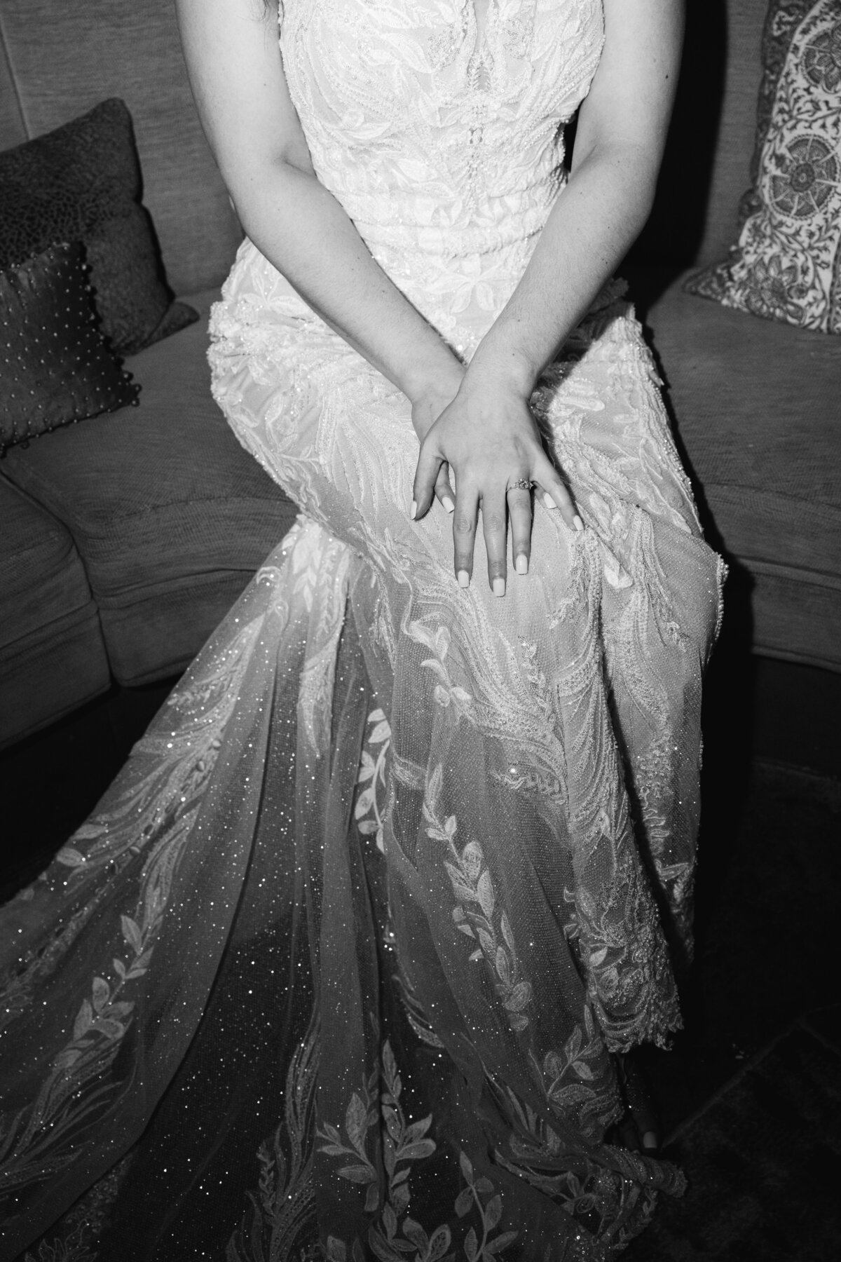 black and white bridal portrait from waist down on couch 
