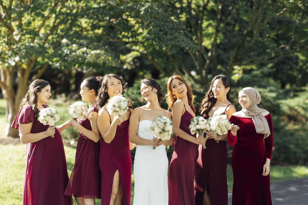 Whitehouse Station | Bridesmaids laughing with Asian bride during summer wedding | New Jersey