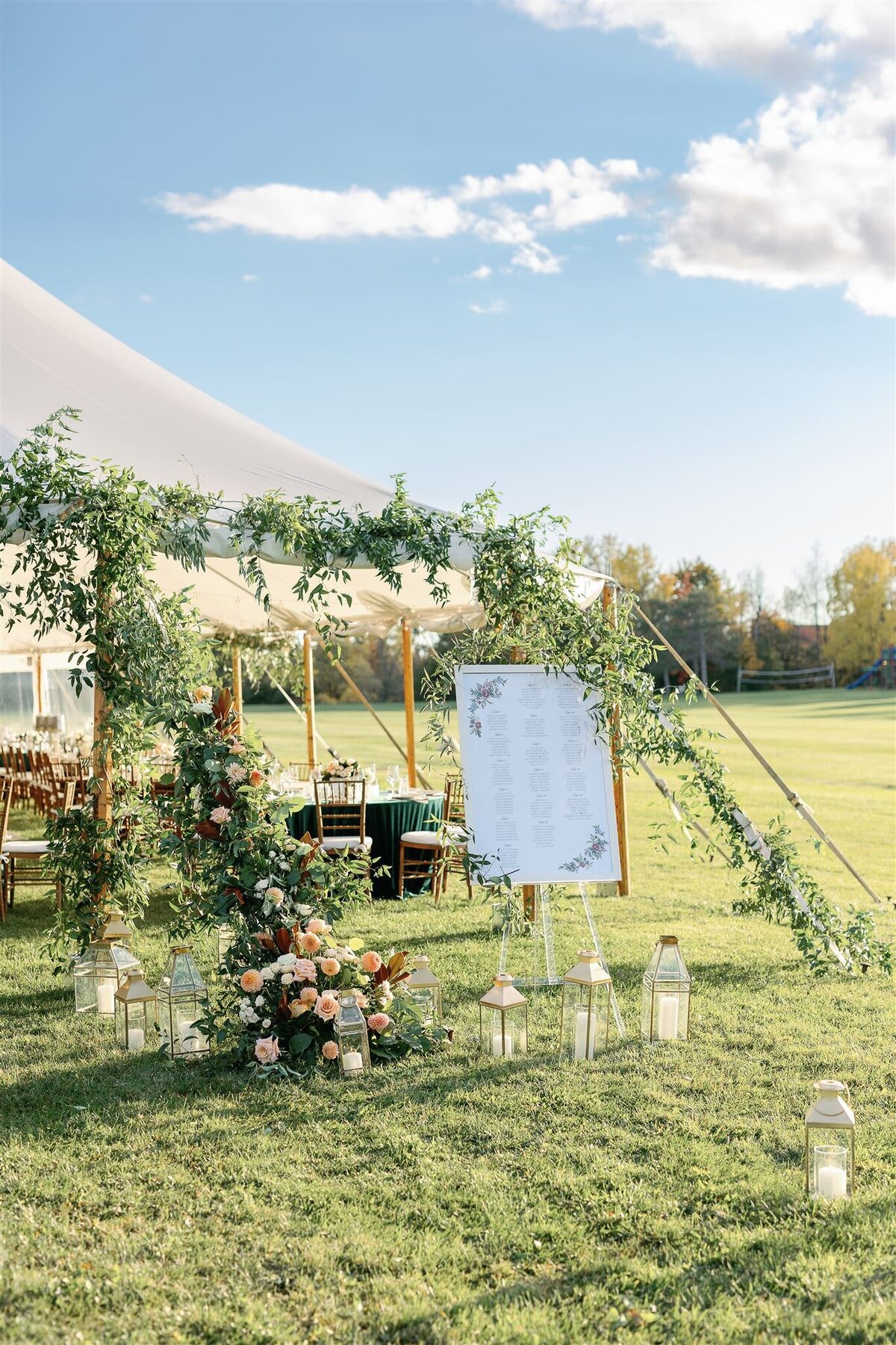 An image of a wedding tent at Basin Harbor decorated with florals